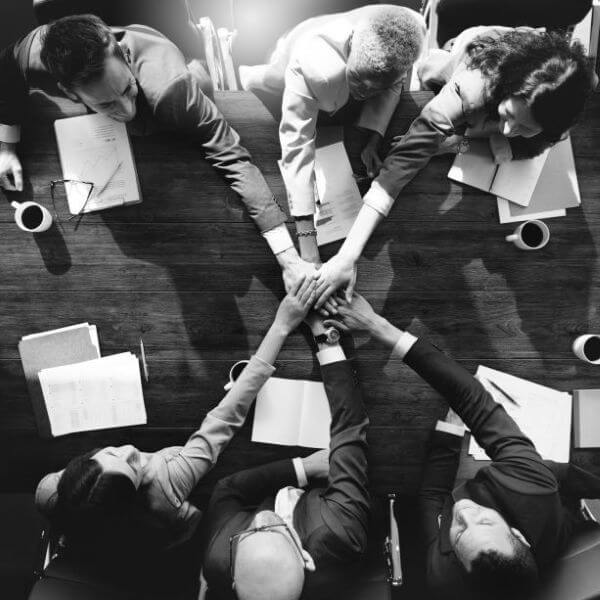 group diverse people with joining hands teamwork